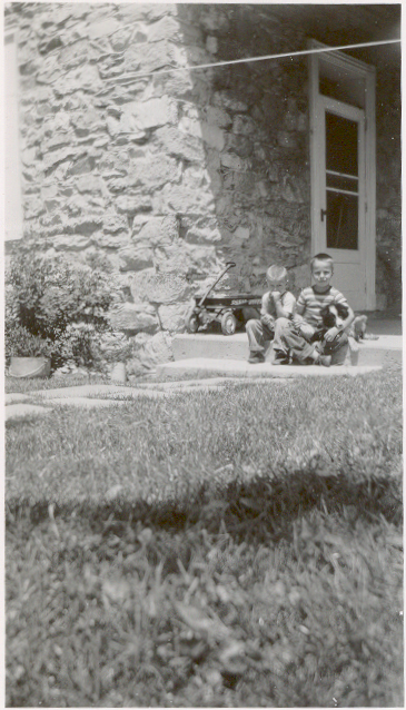 This is me and Reed sitting on the back porch of the Great Stone House in an undated photo that I’m guessing might be from 1955 when I was six. I don’t recognize the dog.